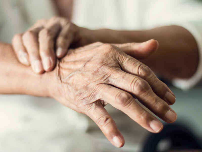 Close up hands of senior elderly woman patient suffering from pa